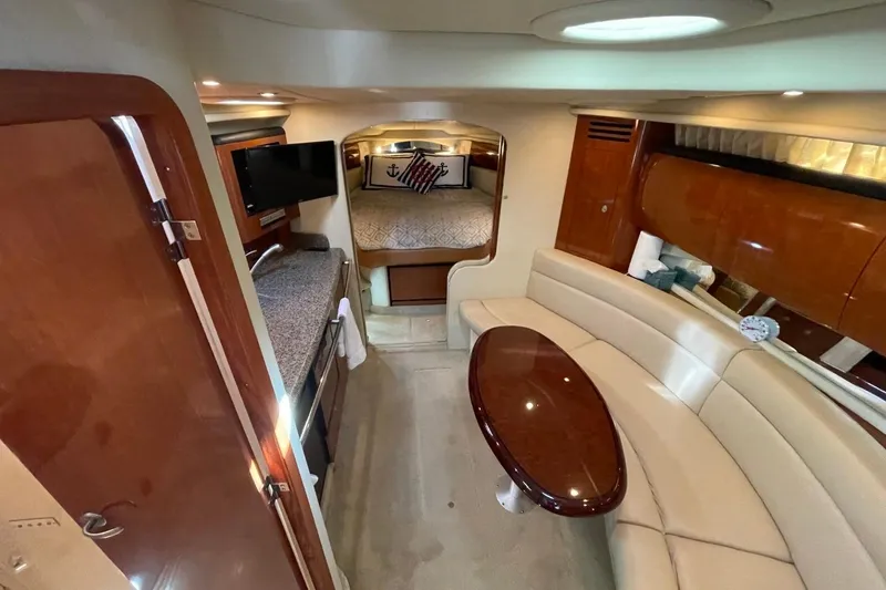 Slide: The Image of Interior of 2006 Sea Ray 360 Sundancer yacht with kitchenette and cozy sleeping area. - 28