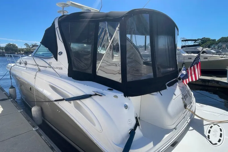 Slide: The Image of 2006 Sea Ray 360 Sundancer yacht docked at marina, featuring sleek design and modern amenities. - 3