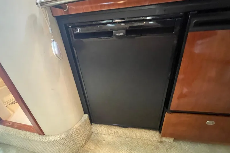 Slide: The Image of 2006 Sea Ray 360 Sundancer bathroom with toilet, shower, and granite countertop. - 40