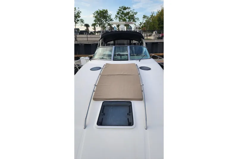 Slide: The Image of Electrical panel inside 2006 Sea Ray 360 Sundancer yacht, featuring control switches and safety instructions. - 48