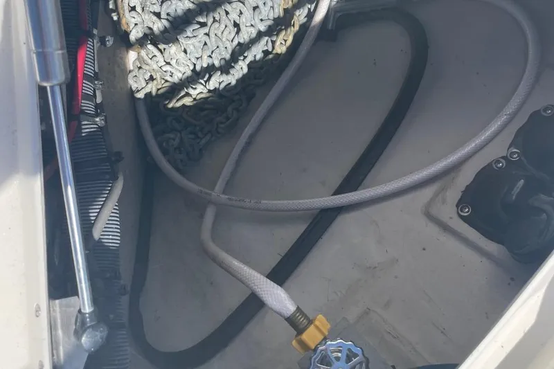 Slide: The Image of 2006 Sea Ray 360 Sundancer yacht with sunpad on deck, docked by calm water. - 54