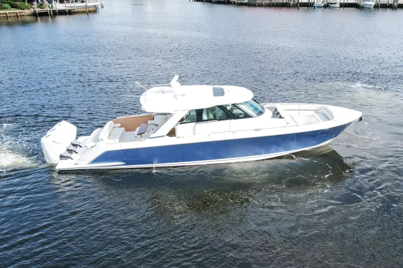 The Image of 2022 Tiara Yachts 48 LS cruising on a calm waterway. - 0