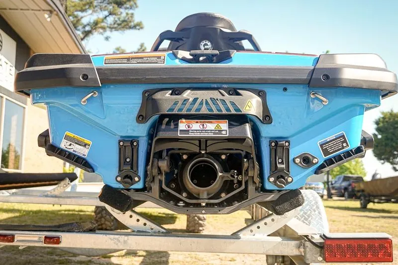 Slide: The Image of 2026 Sea-Doo RXT-X 325 jet ski rear view on trailer, showcasing engine details. - 14