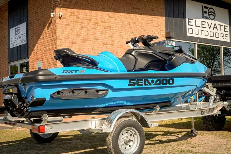 Slide: The Image of 2026 Sea-Doo RXT-X 325 jet ski on trailer at Elevate Outdoors. - 3