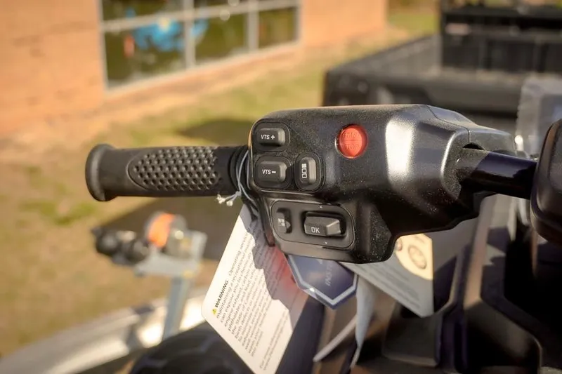 Slide: The Image of Handlebar controls of 2026 Sea-Doo RXT-X 325, featuring buttons and grip. - 9