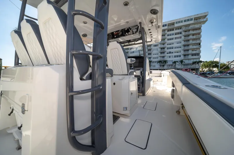 Slide: The Image of 2022 World Cat 400 CC-X boat interior with modern seating and sleek design. - 26