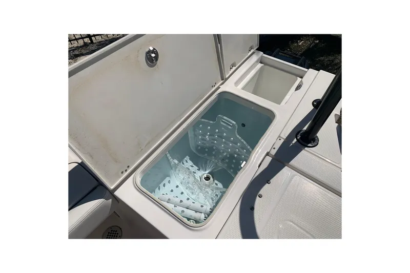 Slide: The Image of Livewell compartment on 2022 Robalo 246 Cayman boat, open lid view. - 10