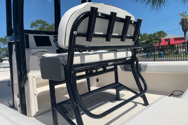 Slide: The Image of 2022 Robalo 246 Cayman boat interior with seating and rod holders. - 14