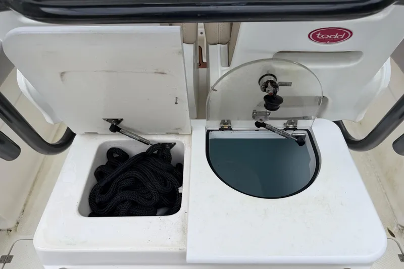 Slide: The Image of 2015 Sea Fox 286 Commander boat storage compartments with rope and water access. - 22