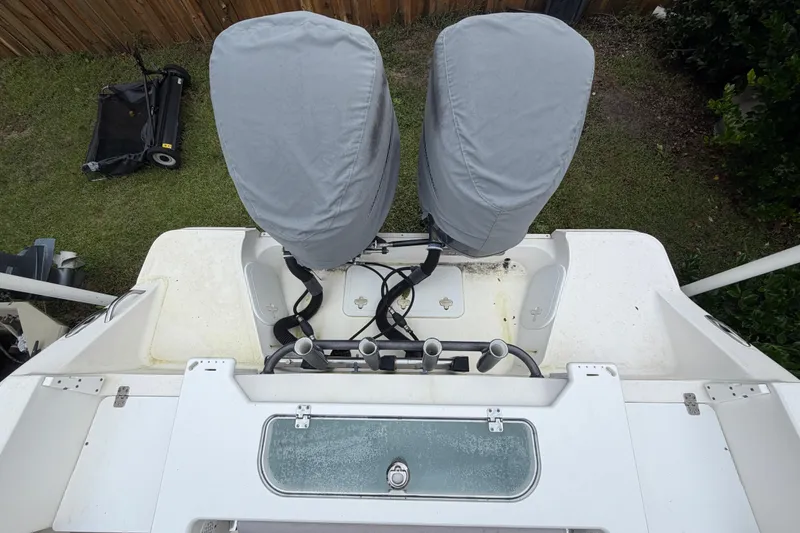 Slide: The Image of 2015 Sea Fox 286 Commander boat with covered engines and rod holders. - 25