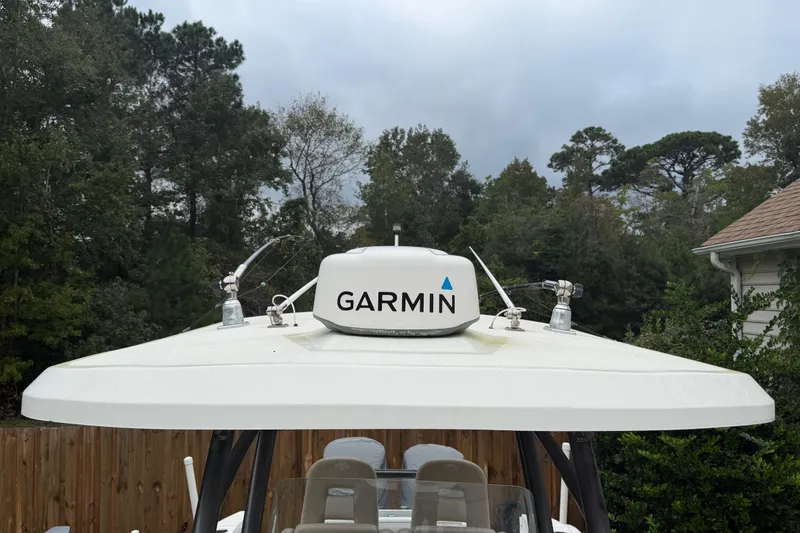 Slide: The Image of 2015 Sea Fox 286 Commander boat with Garmin radar, surrounded by trees. - 9