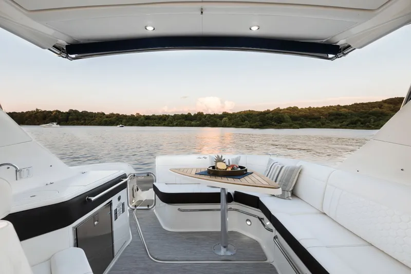 Slide: The Image of Interior of Sea Ray Sundancer 320 yacht, overlooking the lake. - 13
