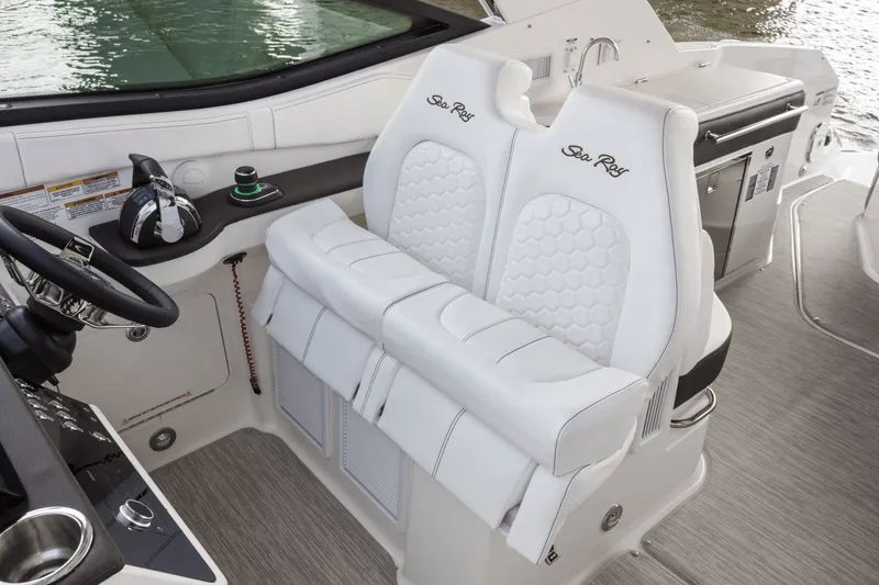 Slide: The Image of Interior of Sea Ray Sundancer 320, 2026, featuring luxurious white seating. - 17