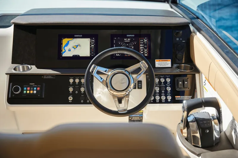 Slide: The Image of 2026 Sea Ray Sundancer 320 cockpit with advanced navigation system. - 20