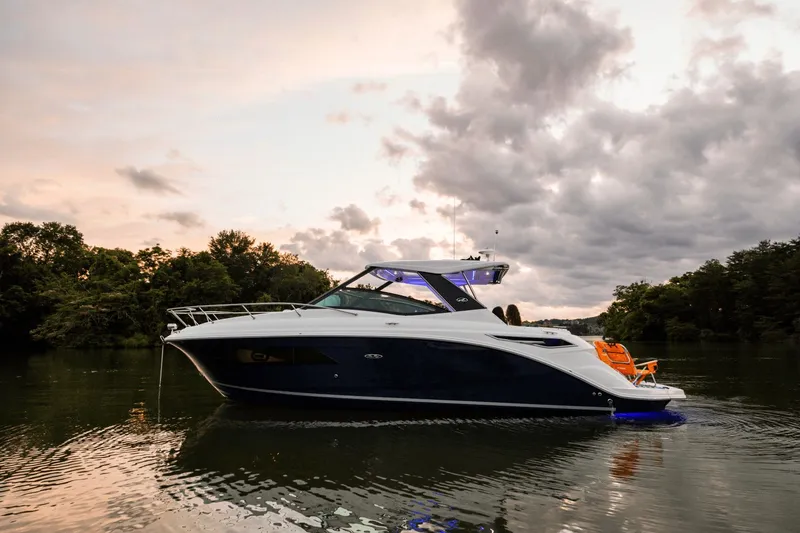 Slide: The Image of 2026 Sea Ray Sundancer 320 on calm water at sunset. - 46