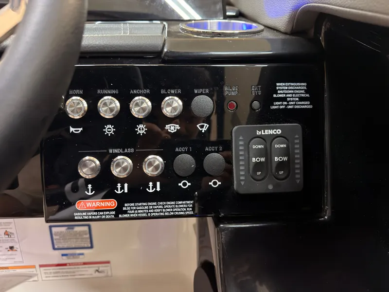 Slide: The Image of The image shows the dashboard of a Sea Ray SLX 280 boat with various switches and indicators. - 43