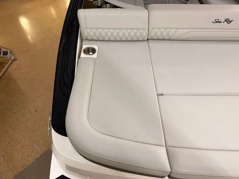 Slide: The Image of The image shows the sleek, upholstered aft deck of a Sea Ray SLX 280 boat with a cup holder. - 8