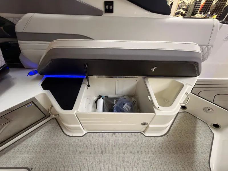 Slide: The Image of The 2026 Sea Ray SLX 280 features an open storage compartment with blue lighting. - 27