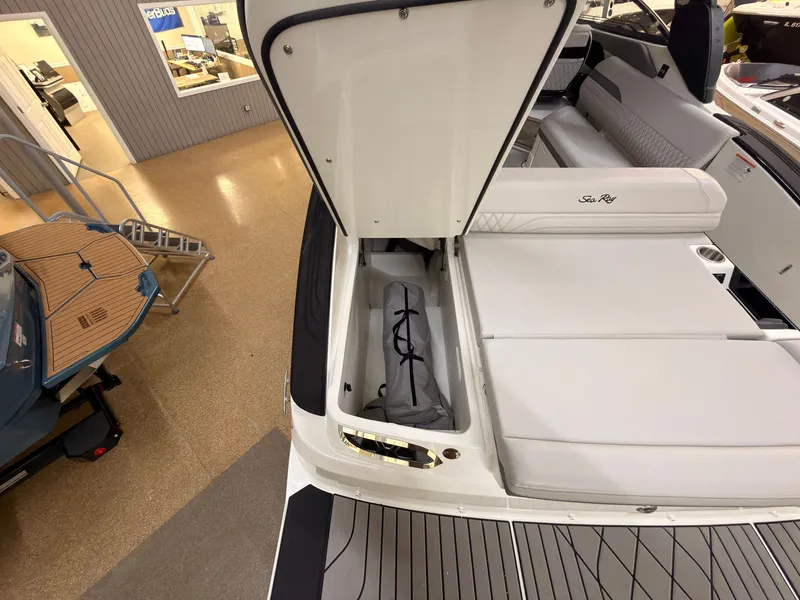 Slide: The Image of The image shows the stern of a Sea Ray SLX 280 with an open storage compartment. - 9