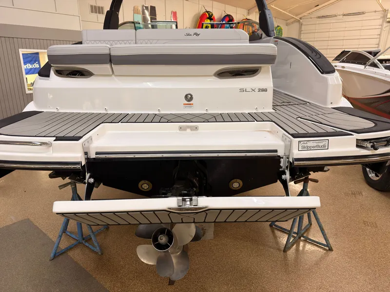 Slide: The Image of The image shows the rear of a 2026 Sea Ray SLX 280 boat with a swim platform. - 5