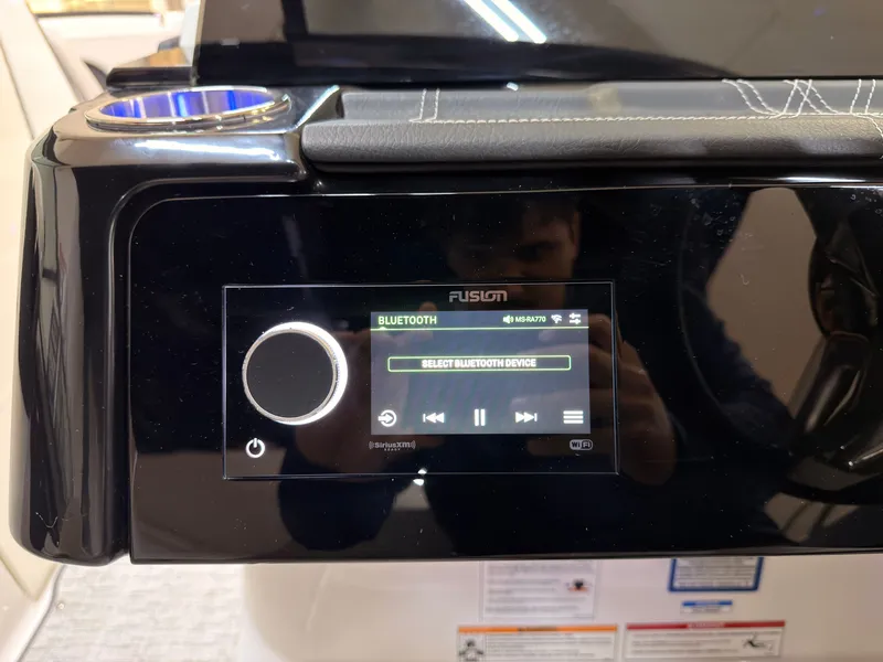 Slide: The Image of The image shows a modern boat audio system with Bluetooth functionality and a digital display. - 41