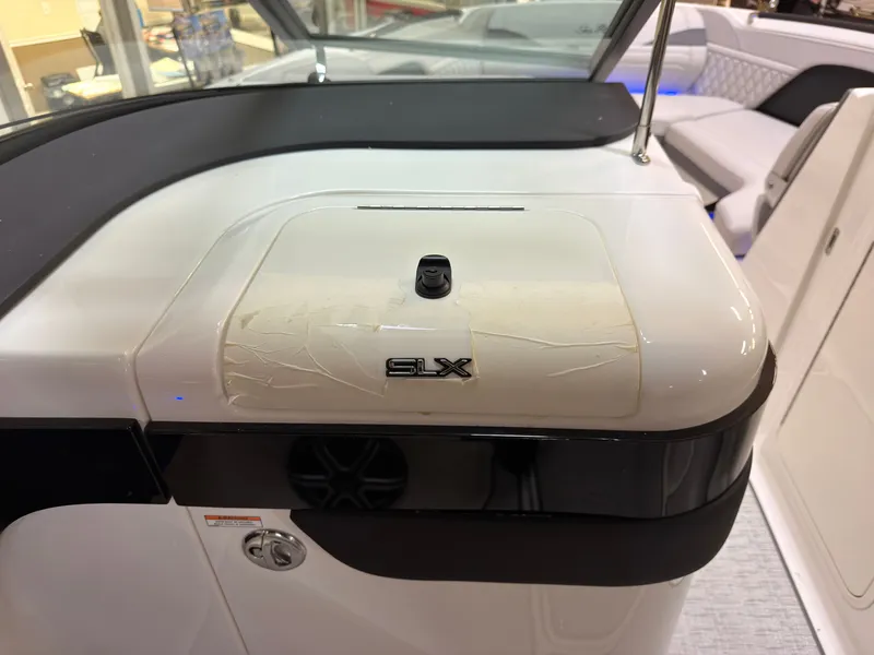 Slide: The Image of The image shows the dashboard of a Sea Ray SLX 280 boat with a sleek design. - 33