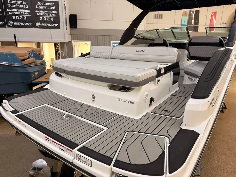 Slide: The Image of The image shows a 2026 Sea Ray SLX 280 boat with sleek gray and white upholstery. - 6