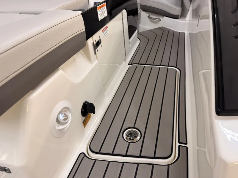 Slide: The Image of The image shows the deck of a Sea Ray SLX 280 boat with sleek wooden flooring. - 11