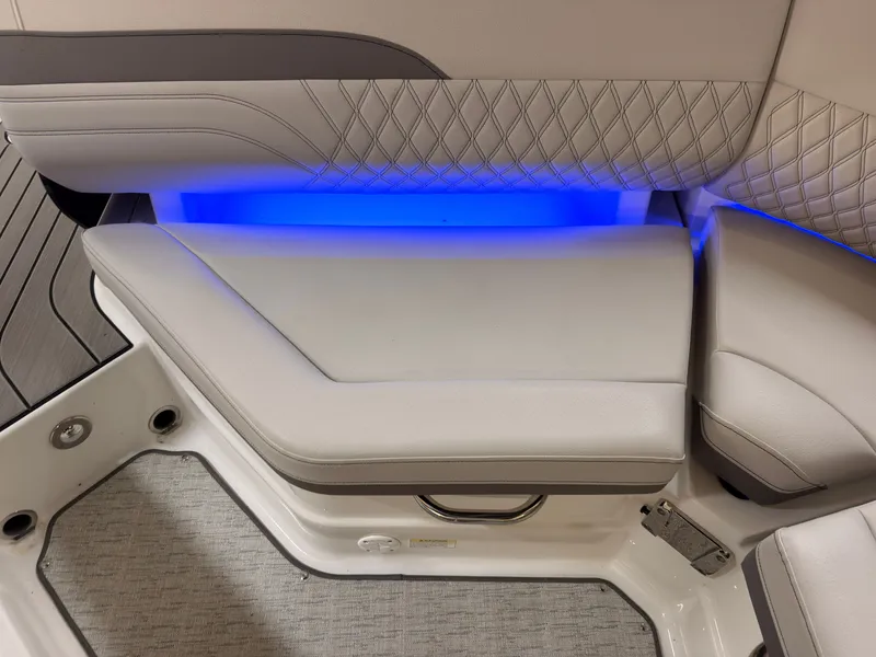 Slide: The Image of The 2026 Sea Ray SLX 280 features elegant upholstery with blue LED lighting. - 18