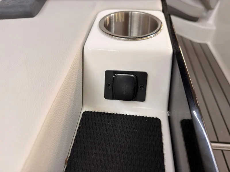 Slide: The Image of Close-up of a cup holder and switch on a boat. - 14