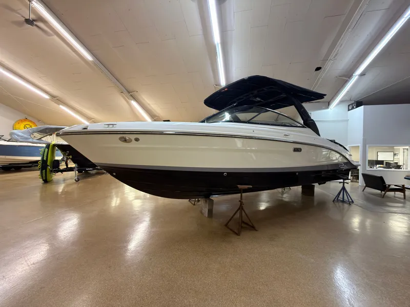 Slide: The Image of A 2026 Sea Ray SLX 280 is displayed in a showroom. It features a sleek, modern design. - 1