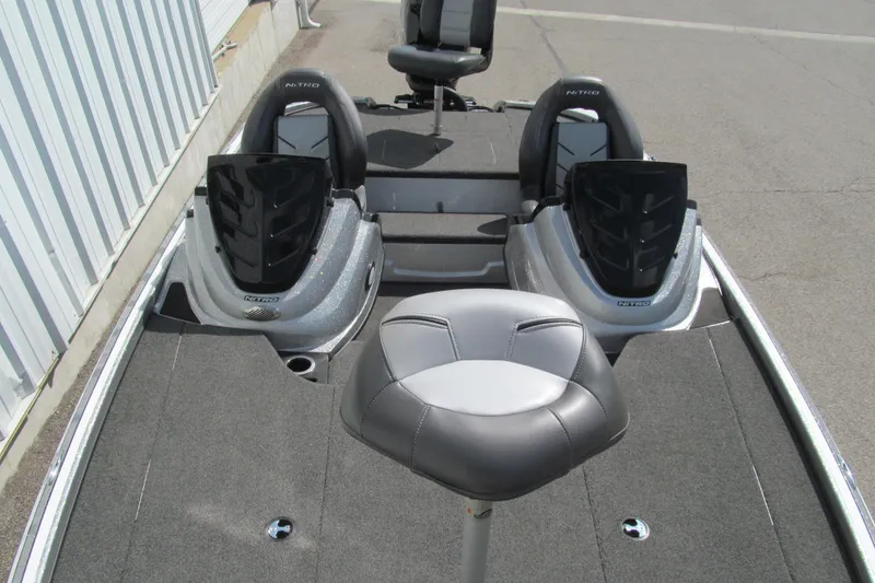 Slide: The Image of 2017 Nitro Z18 boat interior with dual seats and gray upholstery. - 10