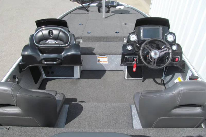 Slide: The Image of Interior of a 2017 Nitro Z18 boat featuring dual consoles and steering wheel. - 5