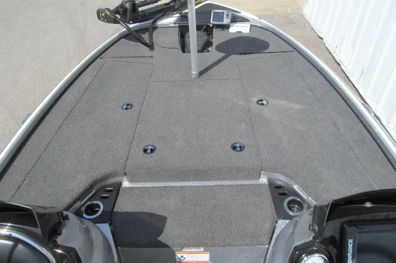 Slide: The Image of 2017 Nitro Z18 boat deck with carpeted surface and fishing equipment. - 7