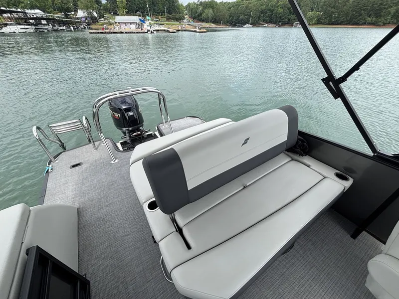 Slide: The Image of Starcraft EXS 3 Q DH 2025 pontoon boat on calm water. - 11