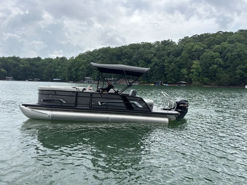 Slide: The Image of Starcraft EXS 3 Q DH 2025 pontoon boat on a lake. - 15