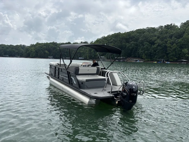 Slide: The Image of Starcraft EXS 3 Q DH 2025 pontoon boat on a serene lake. - 16