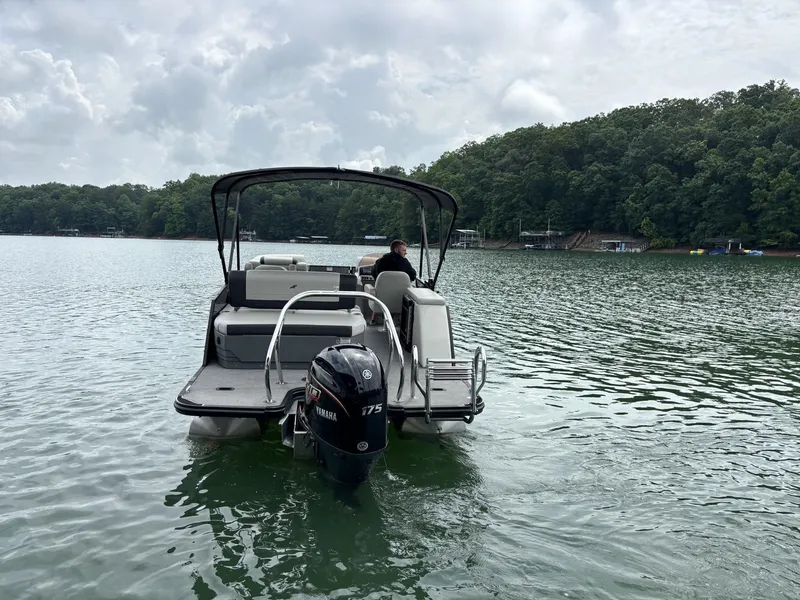 Slide: The Image of Starcraft EXS 3 Q DH 2025 pontoon boat on a serene lake. - 2