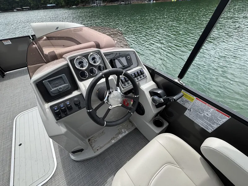 Slide: The Image of 2025 Starcraft EXS 3 Q DH helm on a lake. - 7