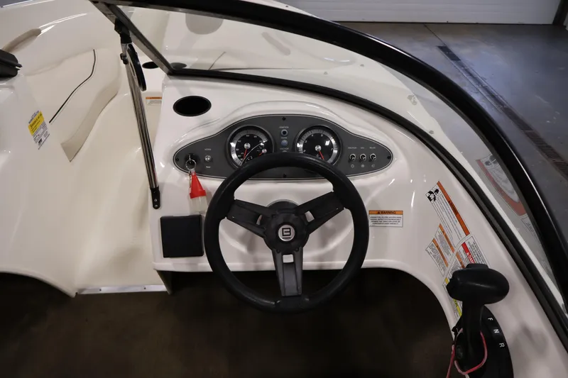 Slide: The Image of 2019 Bayliner 160 Bowrider dashboard with steering wheel and instrument panel. - 14