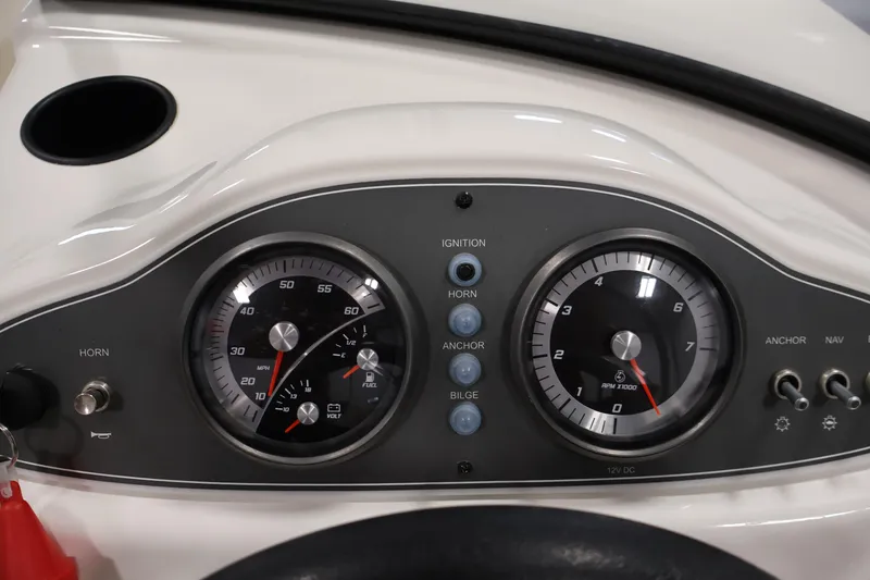 Slide: The Image of Dashboard of a 2019 Bayliner 160 Bowrider boat with speedometer and tachometer. - 16