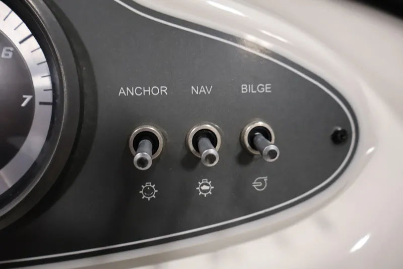 Slide: The Image of Control panel of a 2019 Bayliner 160 Bowrider with anchor, nav, and bilge switches. - 17