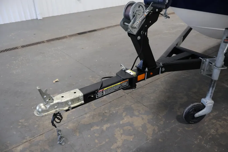 Slide: The Image of Trailer hitch of 2019 Bayliner 160 Bowrider boat in a garage setting. - 31