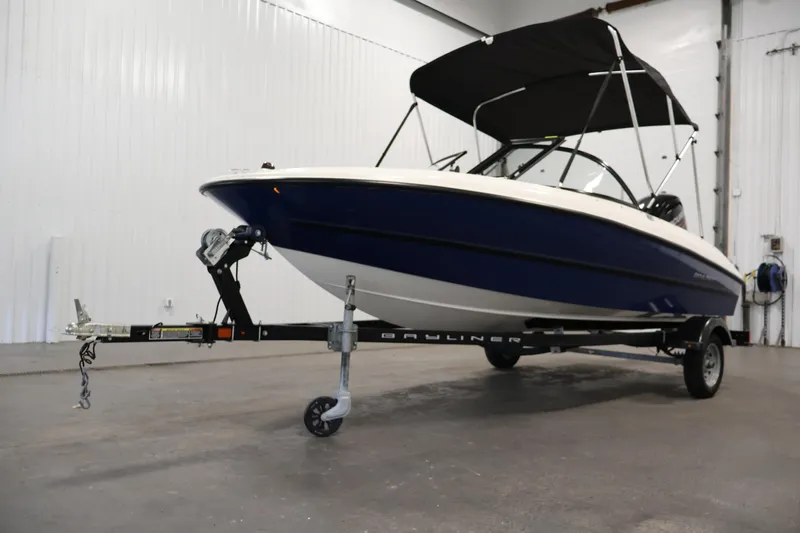 Slide: The Image of 2019 Bayliner 160 Bowrider boat on trailer in indoor storage facility. - 32