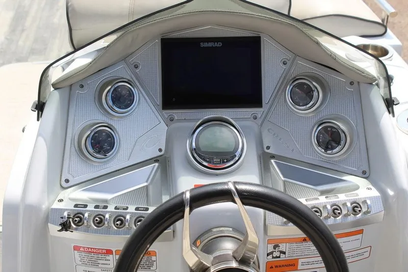 Slide: The Image of Dashboard of 2019 Crest Savannah 250 SLRC boat with gauges and controls. - 14