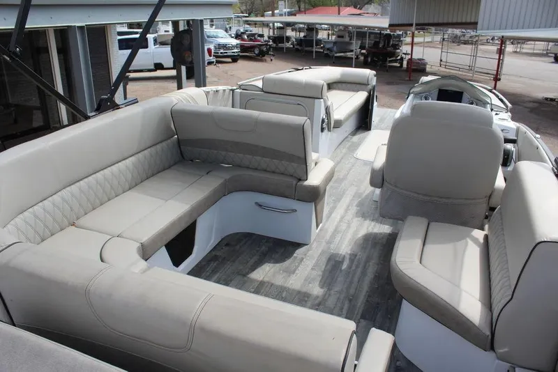 Slide: The Image of 2019 Crest Savannah 250 SLRC pontoon boat interior with spacious seating and modern design. - 6