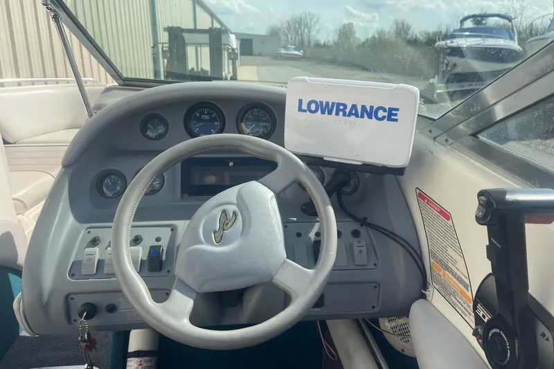 Slide: The Image of Interior dashboard of a 1996 Sea Ray 210 Bow Rider with Lowrance navigation system. - 13