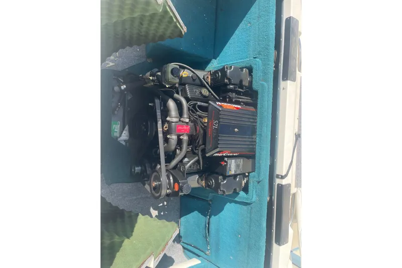 Slide: The Image of Engine compartment of a 1996 Sea Ray 210 Bow Rider boat, featuring a MerCruiser engine. - 22