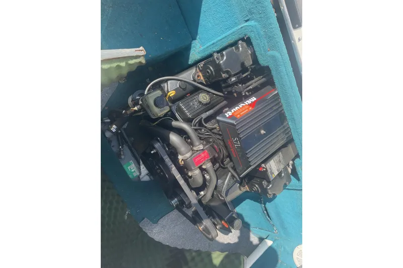 Slide: The Image of Engine of a 1996 Sea Ray 210 Bow Rider boat, featuring MerCruiser components. - 23