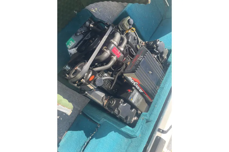 Slide: The Image of Engine compartment of a 1996 Sea Ray 210 Bow Rider with MerCruiser components. - 24